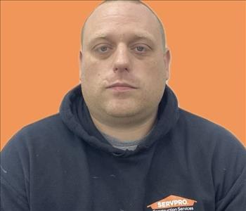 man in front of orange background