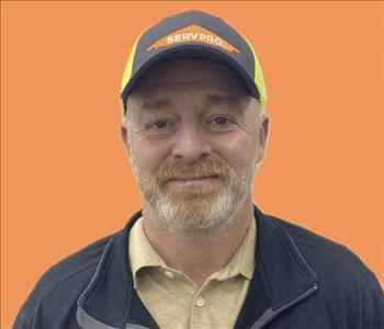 man in front of orange background