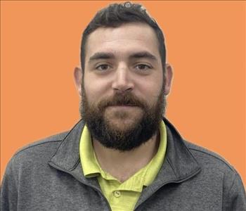 man in front of orange background