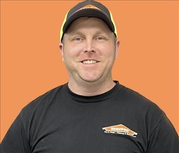 man in front of orange background